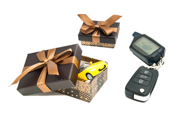 car keys, yellow car and gift boxes