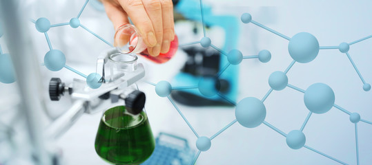 close up of scientist filling test tubes in lab