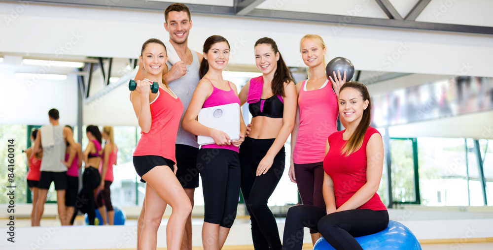 Wall mural group of smiling people in the gym