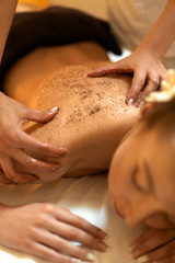 Body Scrub. Beautiful Blonde Gets a Salt Scrub Beauty Treatment © puhhha