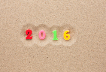New year 2016 written in the sand