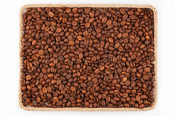 Frame made of rope with coffee  beans  lying on a white backgrou