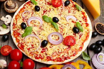 Food ingredients for pizza on table close up