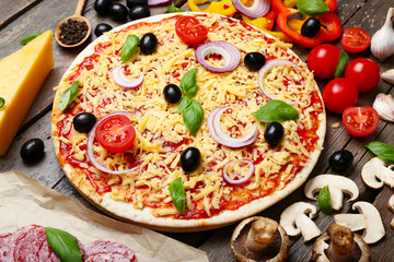 Food ingredients for pizza on table close up