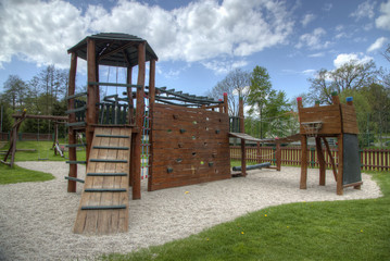 Fototapeta na wymiar playground with slides and climbing frame