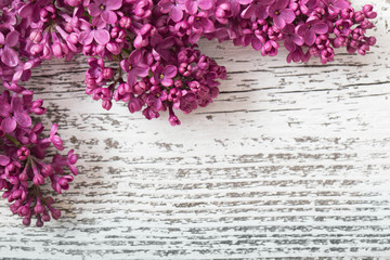 The beautiful lilac on a wooden background