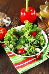 fresh vegetable salad in bowl on table close up