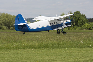 Historic biplane, white and blue design