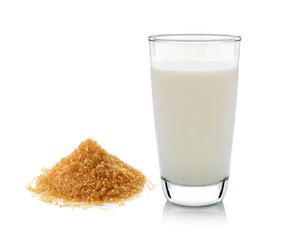 glass of milk and sugar isolated on white background