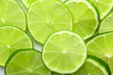 Fototapeta na wymiar Sliced fresh limes, closeup