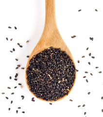 sesame in the spoon on white background