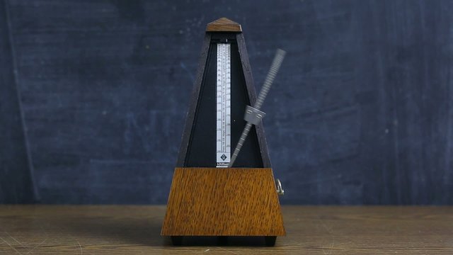 Metronome clicking on a table