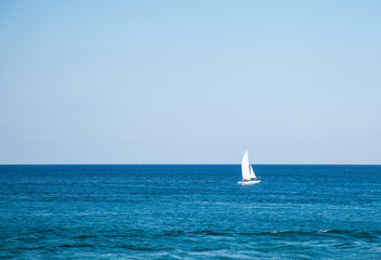 Obraz premium Boat in blue sea