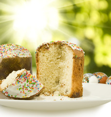 Easter cupcakes and eggs on a green background