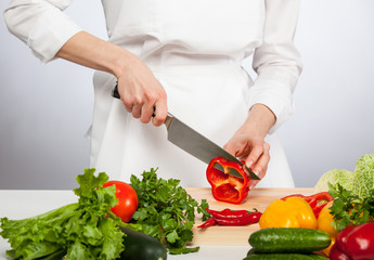  Cook's hands preparing salad