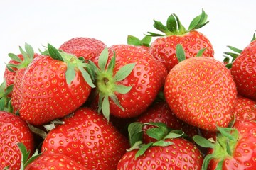 Fresh strawberries piled together.