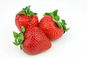 Fresh strawberries piled together.