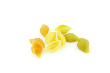 Tri colore Conchiglie pasta on a white background. Made of durum wheat colored with natural pigments.