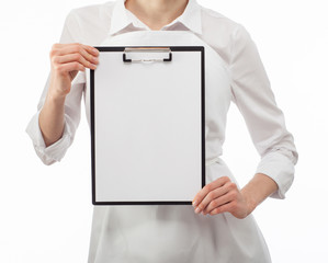 Woman cook's hands showing blank clipboard