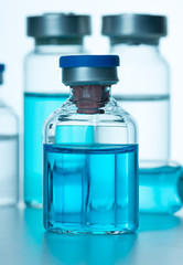Vials of the vaccine, blue background