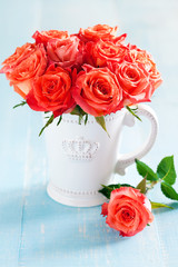 Bouquet of roses in a cup, selective focus