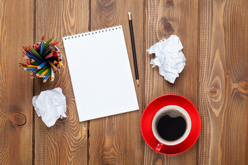 Office desk table with supplies and coffee cup