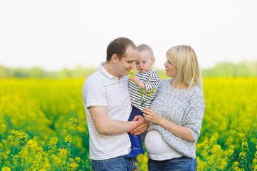 Mother, the father and the kid are on a rape field