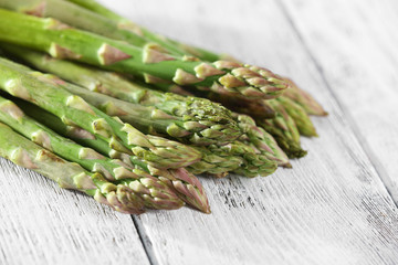 Fresh asparagus on wooden table, closeup