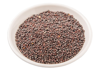 Black mustard seed in white bowl over white background