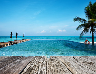 Swimming pool and old wooden pier