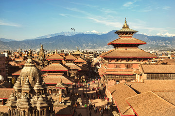 KATHMANDU, NEPAL - CIRCA DEC, 2014: View of the Patan Durbar Square. One of the 3 royal cities in Kathmandu, a very popular tourist place. - obrazy, fototapety, plakaty