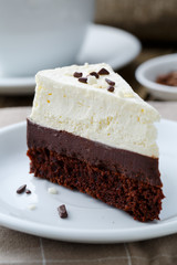 Vanilla cheesecake slice on wooden background.