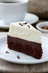 Vanilla cheesecake slice on wooden background.