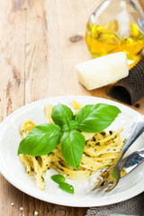 Pasta tagliatelle with pesto sauce and basil 