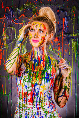 Plakat Beautiful young woman covered with paints