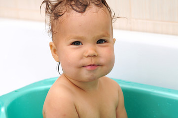 baby portrait sitting in the bath