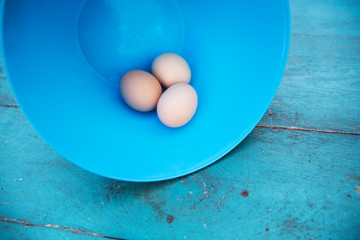 Easter - natural white eggs in a blue bowl 