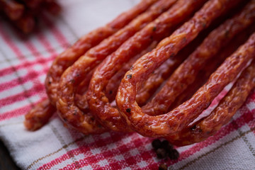 Sausage or kabanos and pepper on vintage wooden boards