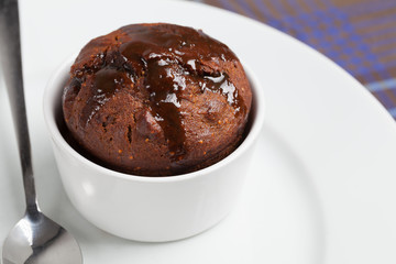 Fig pudding in a white ramekin.