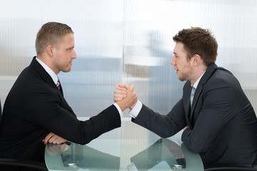 Two Businessman Wrestling