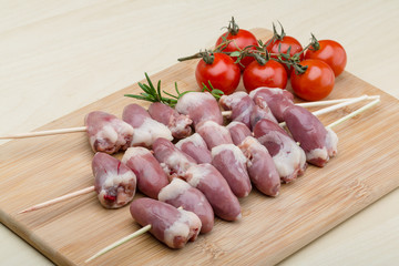 Raw chicken hearts for barbecue