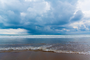 Tropical beach and beautiful sea. Blue sky with clouds in the ba