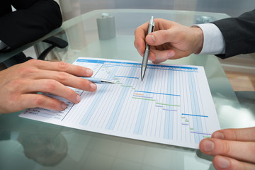 Two Businessmen Making Gantt Diagram