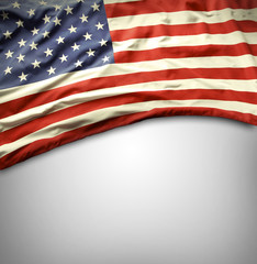 American flag on grey background. Copy space