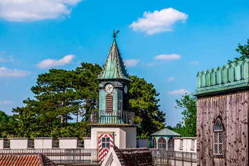 Obraz premium Clock tower and roofs of Franzensburg castle, Austria