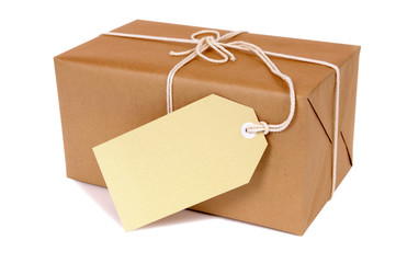 Brown paper wrapped package parcel box one single small with white string address or message label...