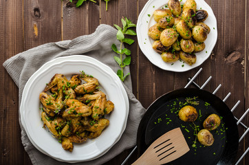 Roasted chicken wings with new potato