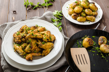 Roasted chicken wings with new potato