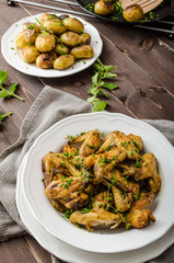 Roasted chicken wings with new potato