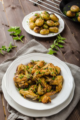 Roasted chicken wings with new potato